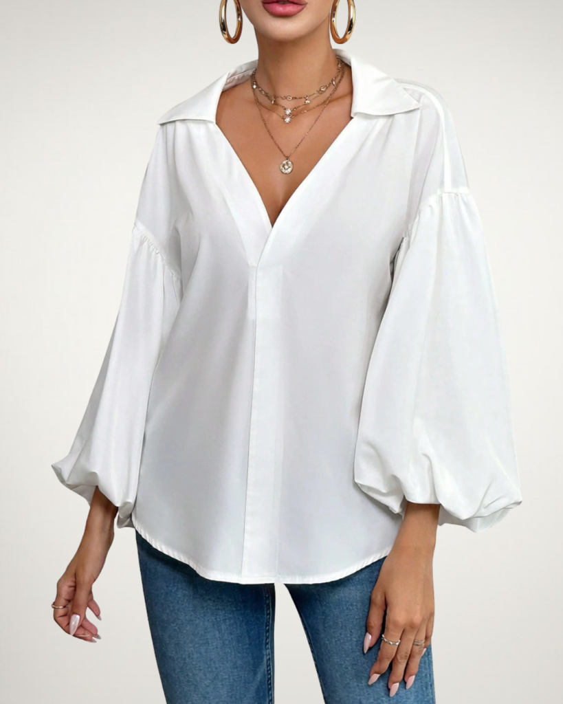 Jazzberry Street model wearingThe Gemma Loose Blouse in white.